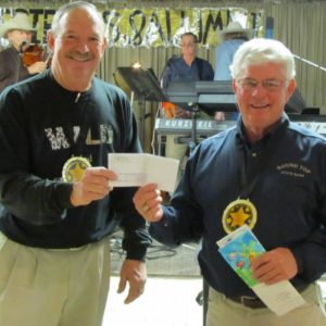 In this 2012, photo Ronny Sacks presents a check on behalf of the Round Top Carmine Education Foundation.