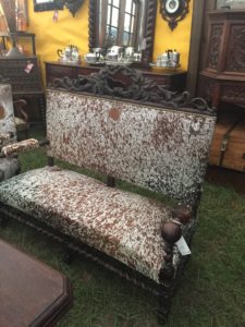 McLarens Antiques and Interiors Round Top cow-hide covered settee