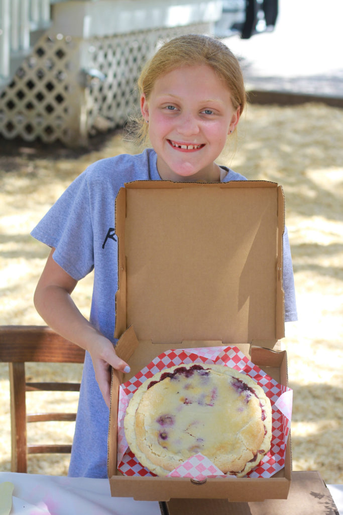 Sadie Royer holding a Junkberry Pie
