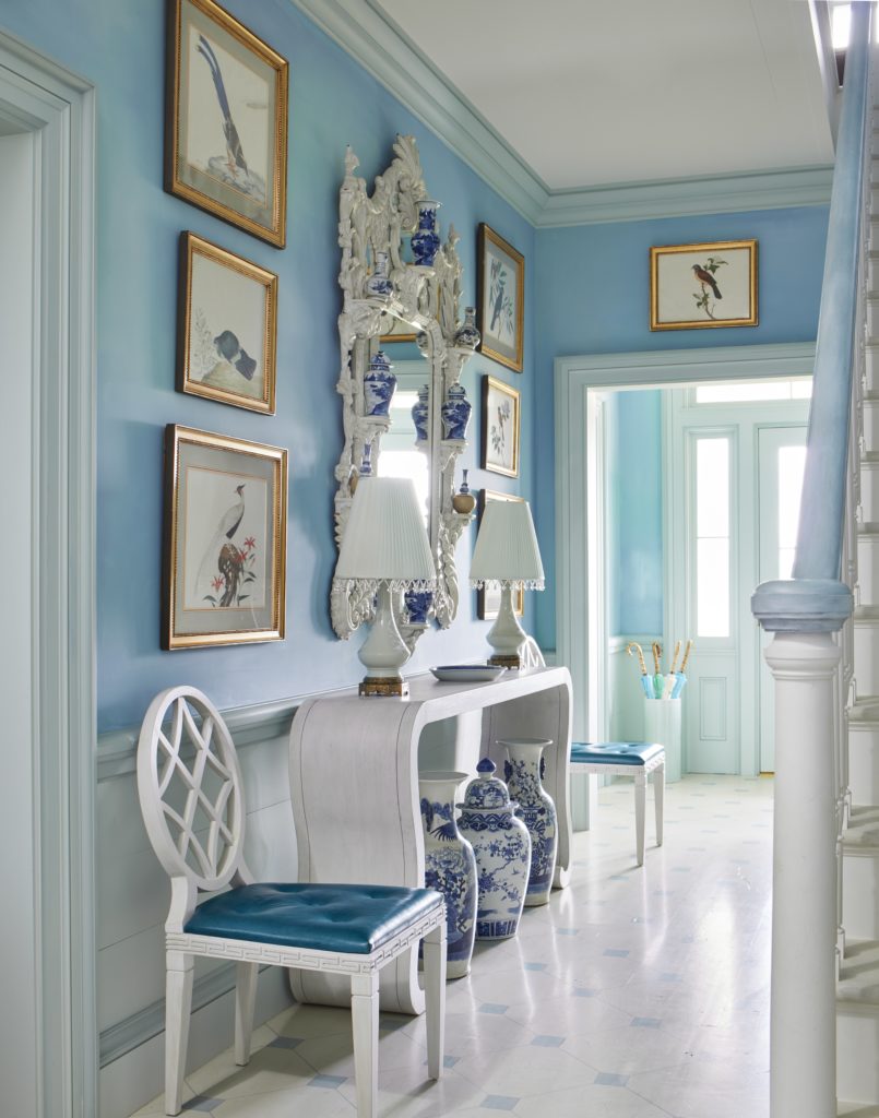 A central hallway extending from the front to back doors is cocooned in Bailey’s favorite blue hues.