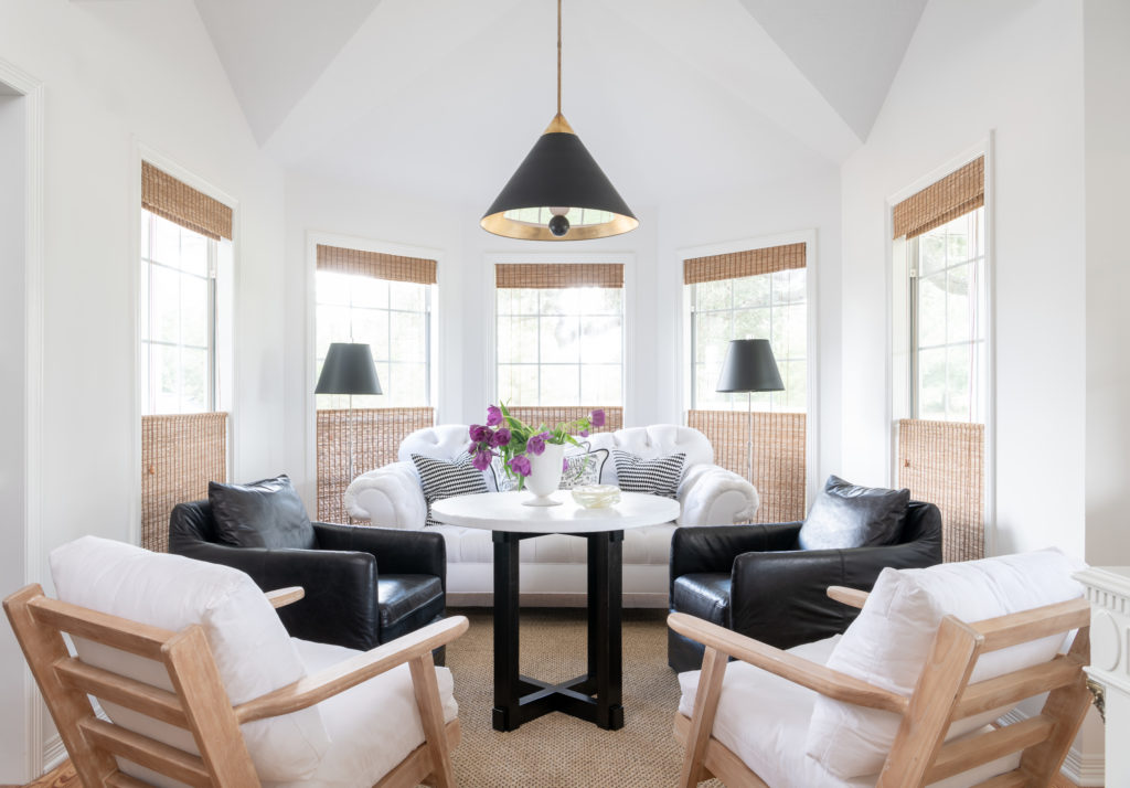 In the TV room, Kelly Wearstler pendant from Visual Comfort. Chairs from Wildflower Organics, Austin. Table from Area. Leather chairs from Paul Michael Company. Sisal rug, Creative Flooring Resources. Hunter Douglas woven raffia shades. Ralph Lauren lamps from Shabby Slips. (Photo Jack Thompson.)