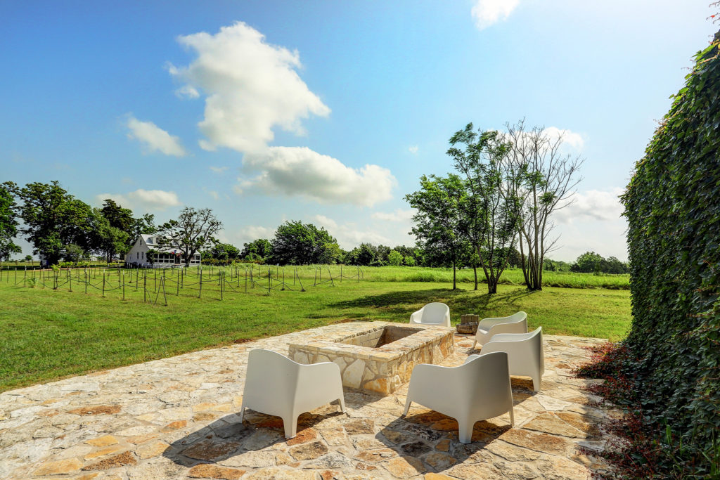 Outdoor seating with a view of the 30-acre property in Austin County.