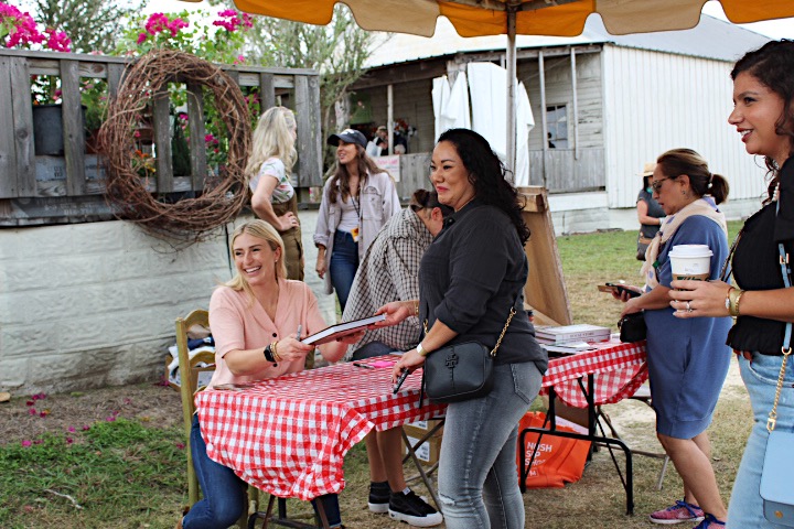 Jasmine Roth with a fan.