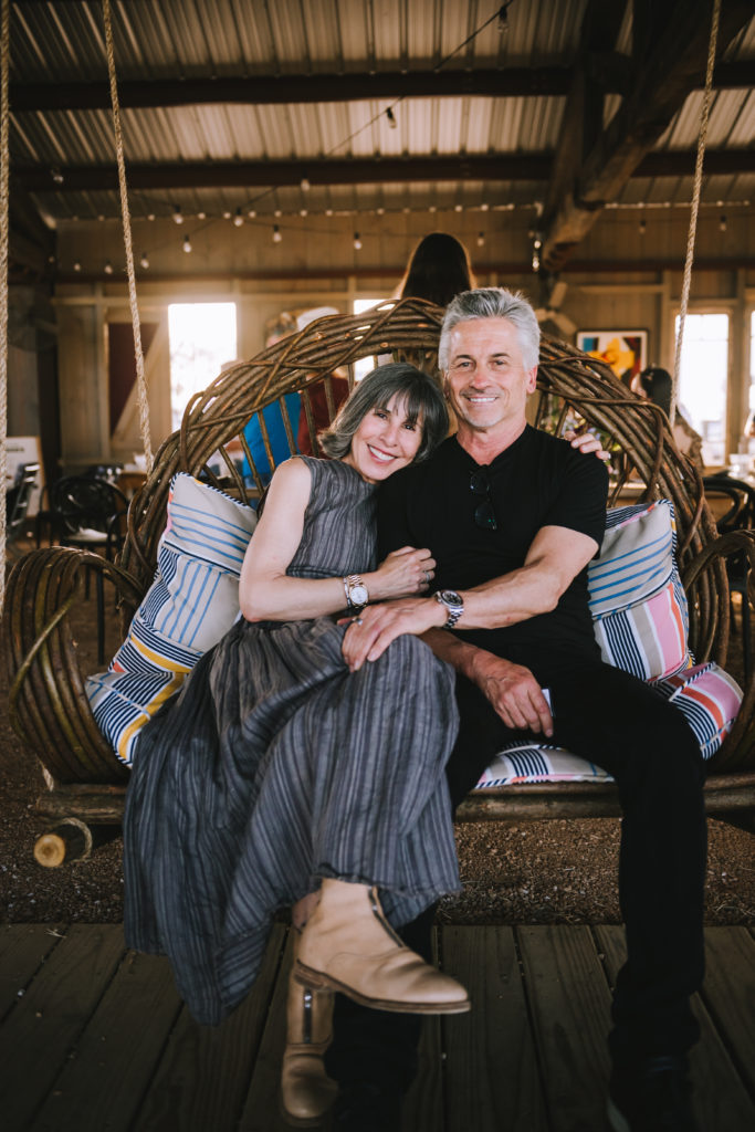 Brooke and Steve Gianetti snuggle on a bent willow swing from Around The Bend Willow Furniture at The Halles. (Photo by Heather Robards)