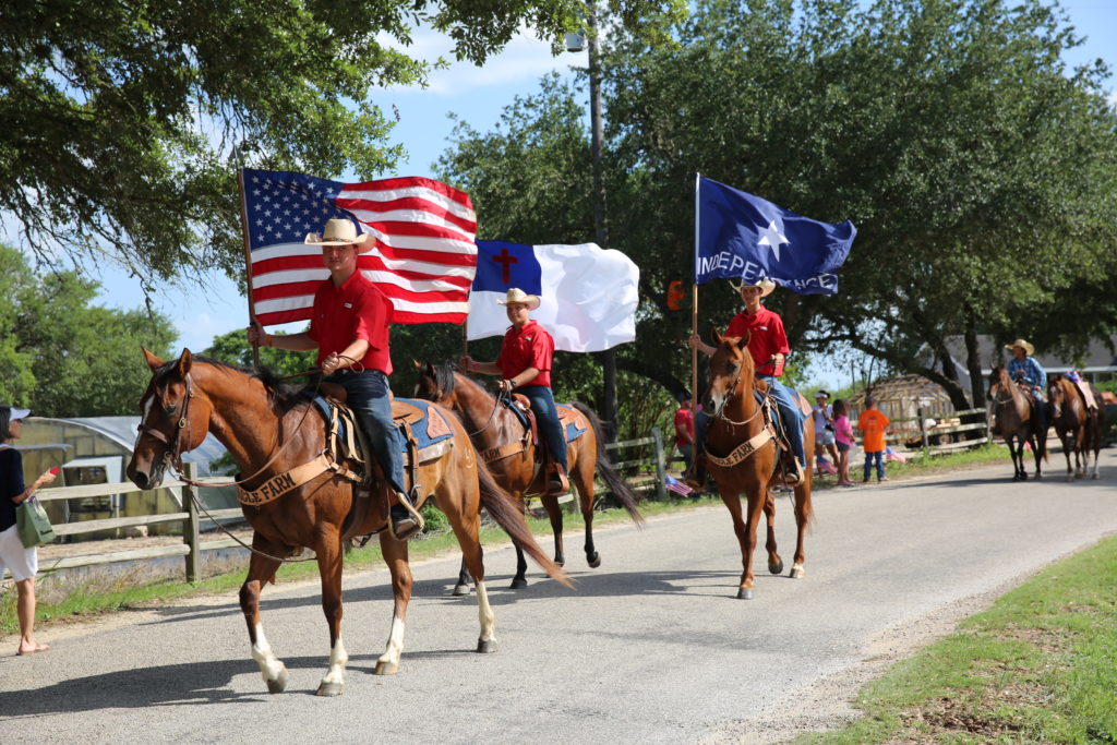 Fourth of July Round Top Residents of Miracle Farm ride through old town for the Fourth of July. (Photo by Amber Westerfeld)